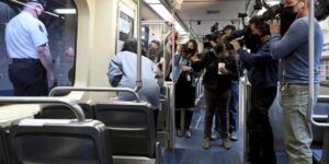 An individual apprehended for attempting rape on a Midtown subway train; a woman was rescued by construction workers